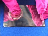 gloves hand holding mirror with substans