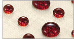 Drops of red liquid on fabric