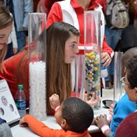 Volunteers interact with visitors
