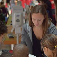 Volunteers interact with visitors