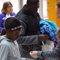 Volunteers interact with visitors