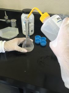 An RET participant performs an experiment