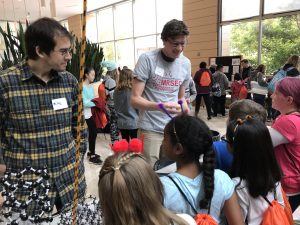 Wisconsin Science Festival Volunteers explaining science