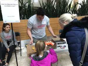 Wisconsin Science Festival Volunteers explaining science