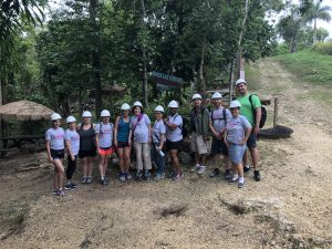The RET cohort of 2019 poses outside La Cueva Ventana